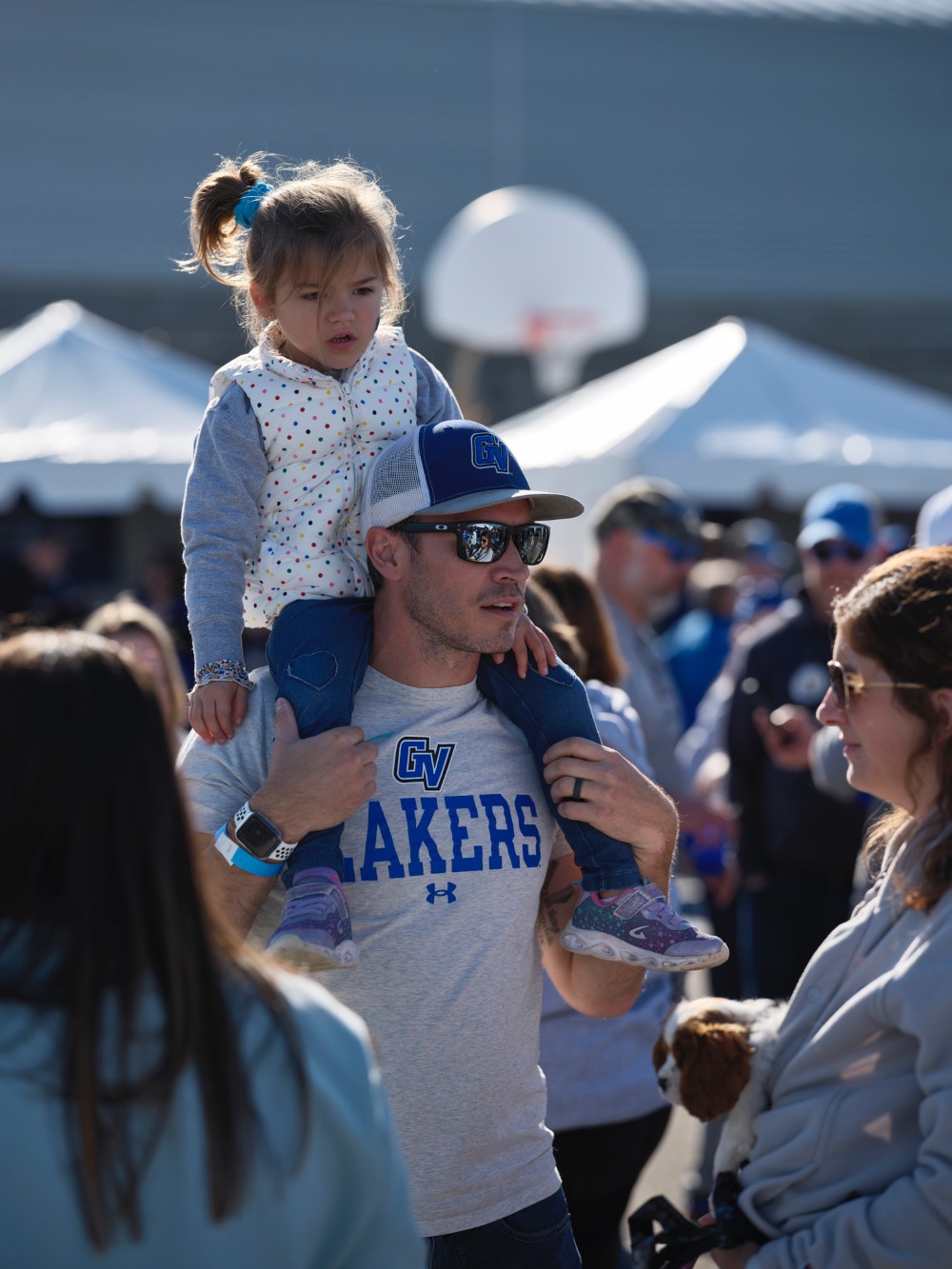 Dad with daughter on his shoulders
